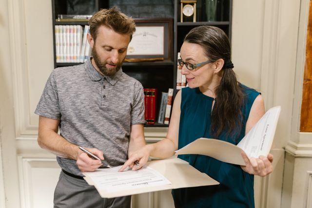two people reviewing documents